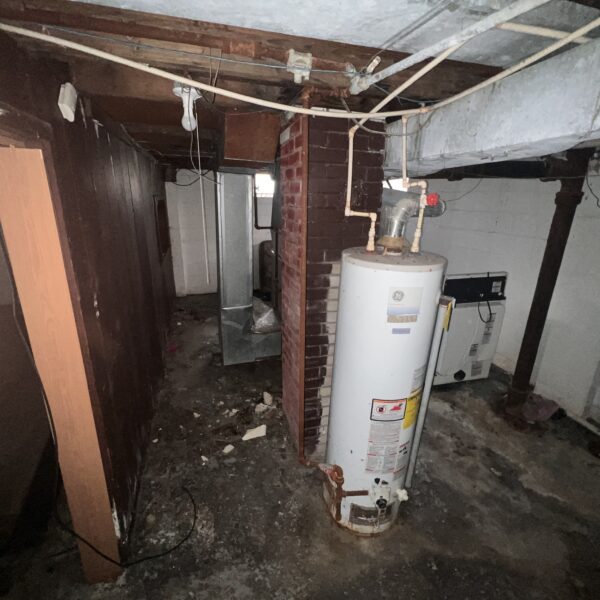 a white color tank in the basement