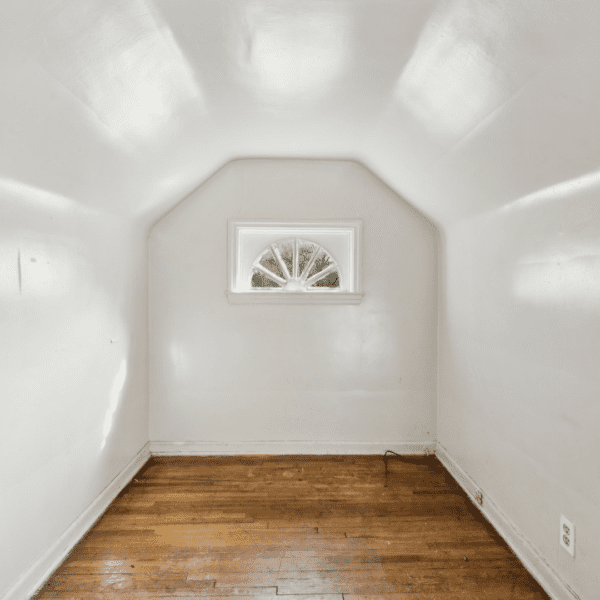 an empty room with white walls